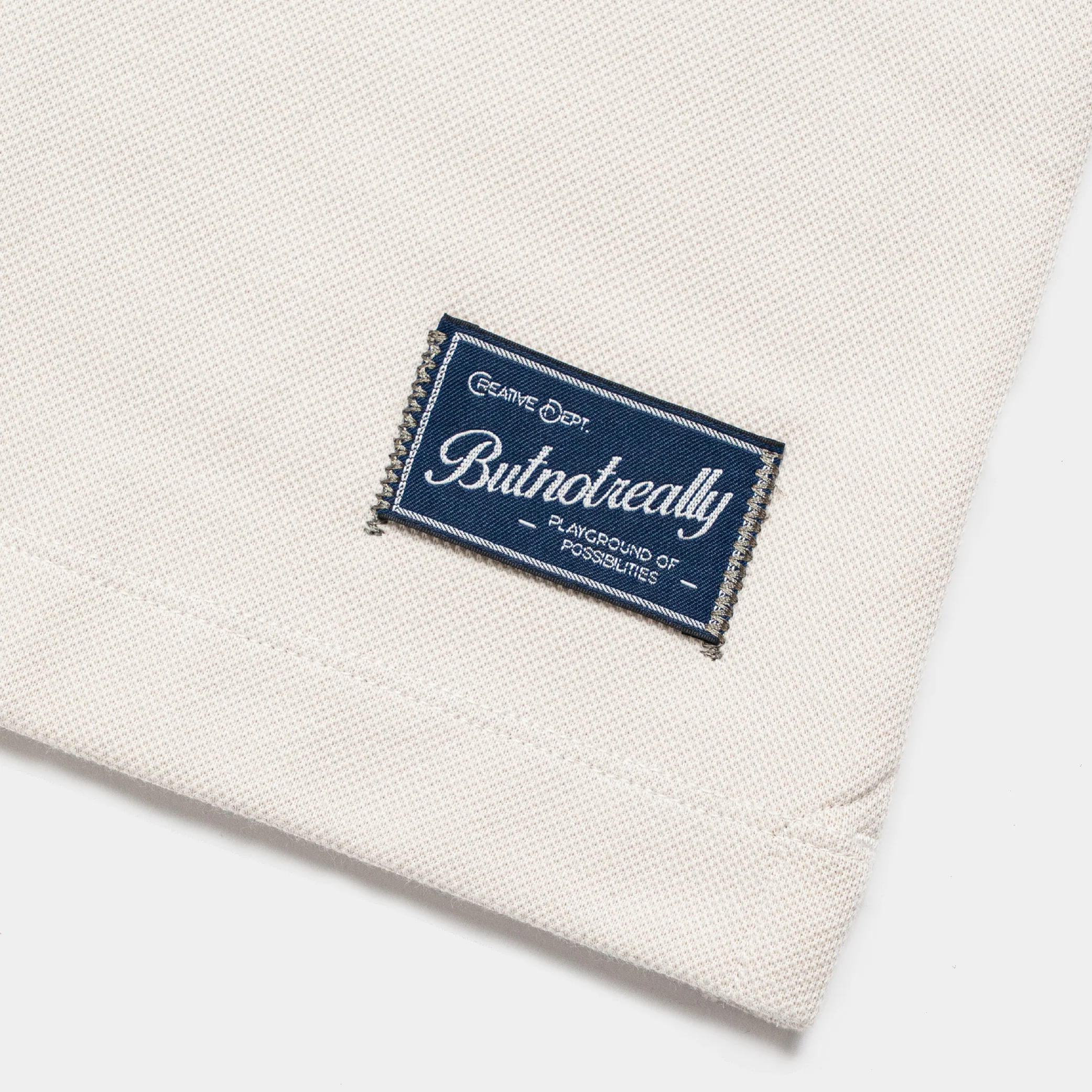 ButNotReally™ Graphic Interlock Oversized Polo Tee - Image 8