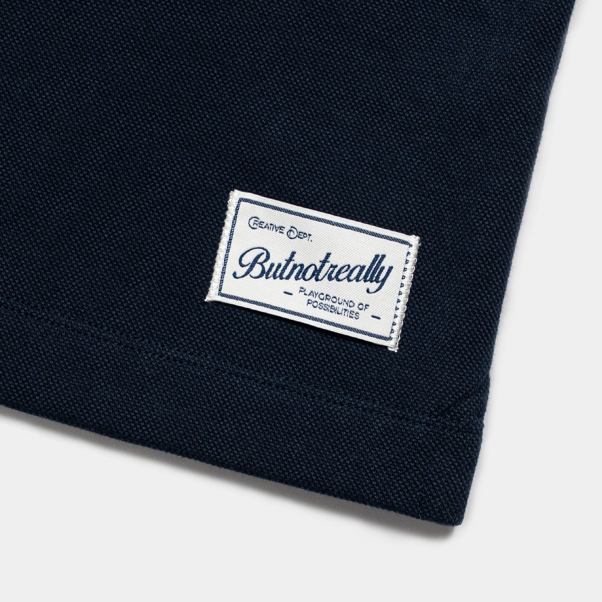ButNotReally™ Graphic Interlock Oversized Polo Tee - Image 8