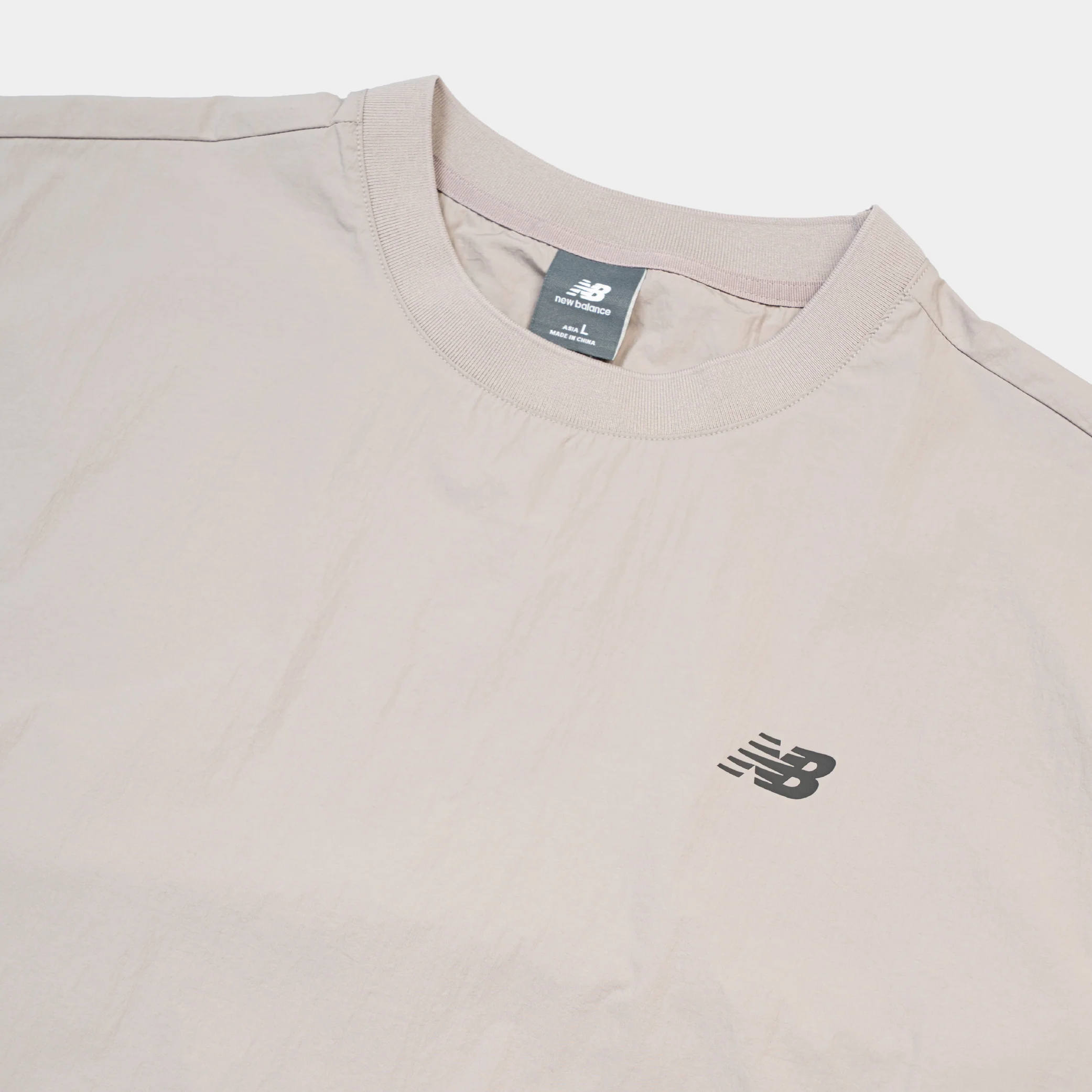 New Balance NBX Shifted 2 Woven Tee - Image 3