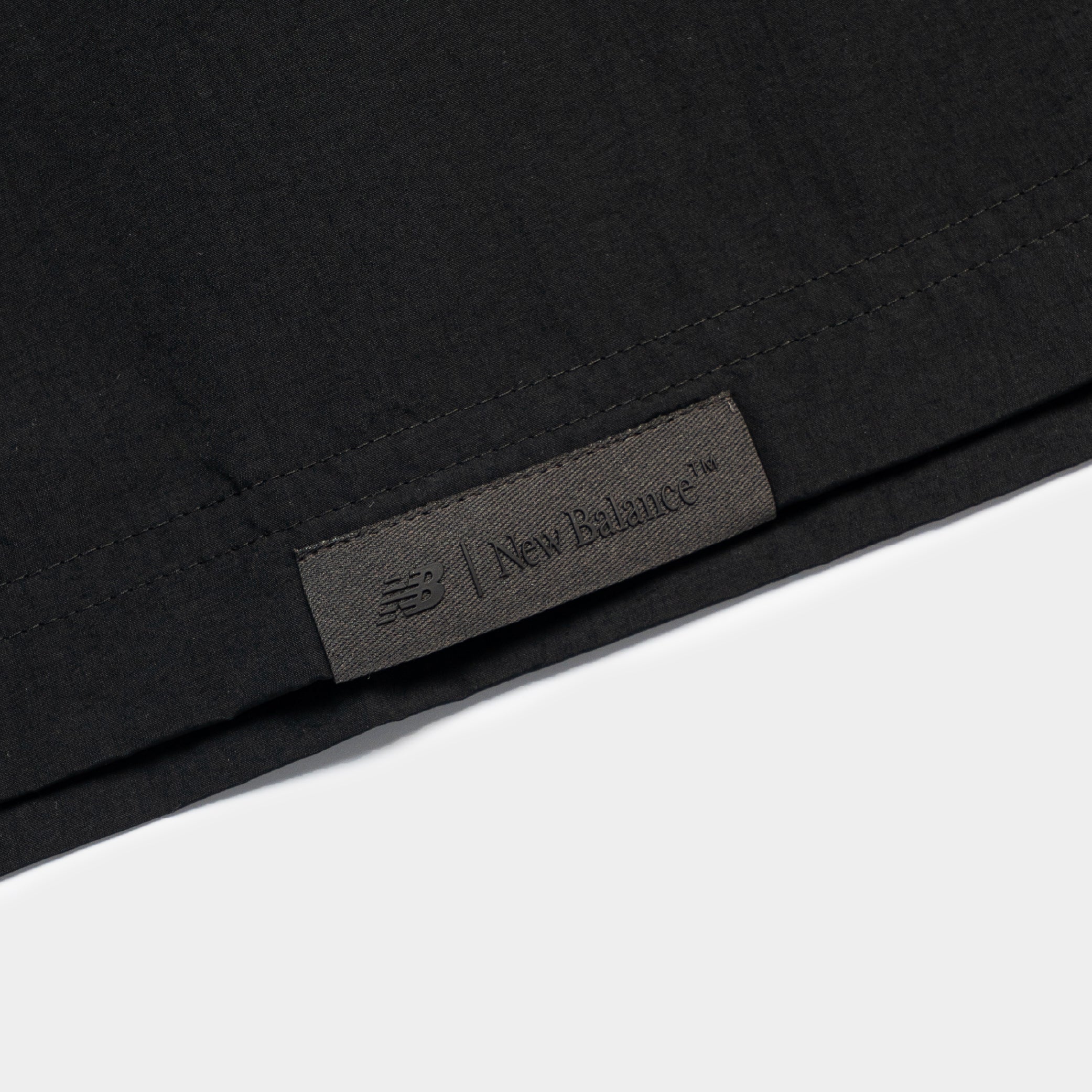 New Balance NBX Shifted 2 Woven Tee - Image 4
